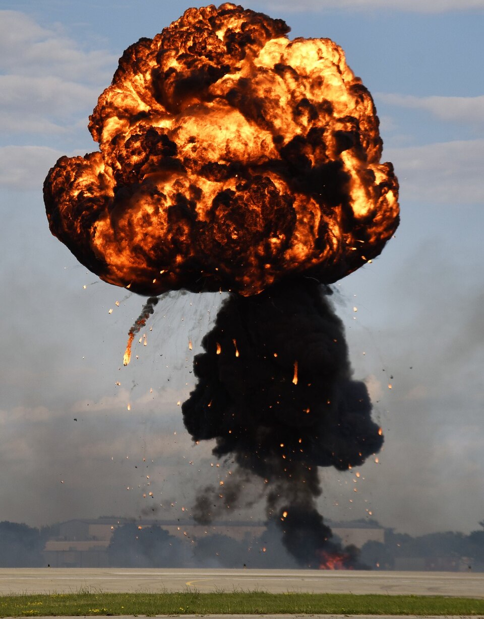 Orange fireball explosion against a dark background